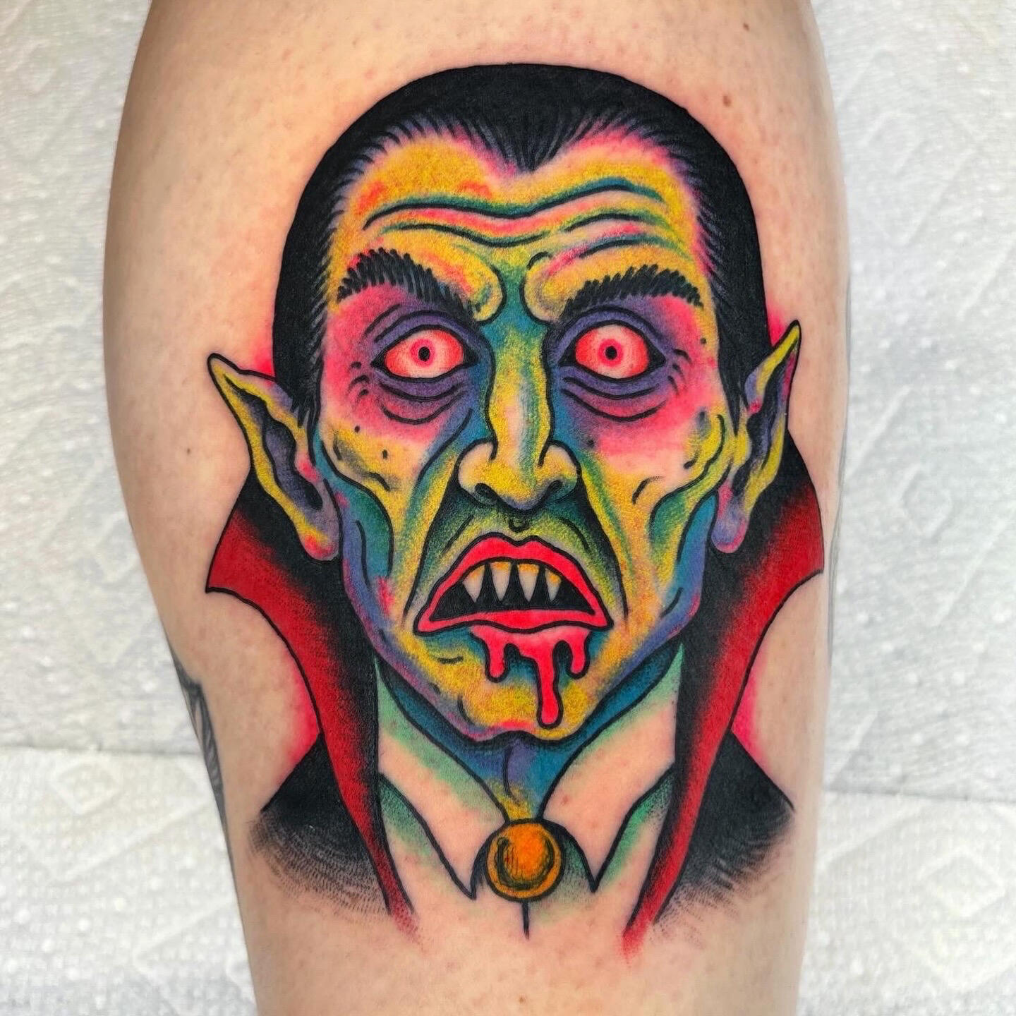 A colorful tattoo of a vampire by Randy Conner in Portland, Oregon